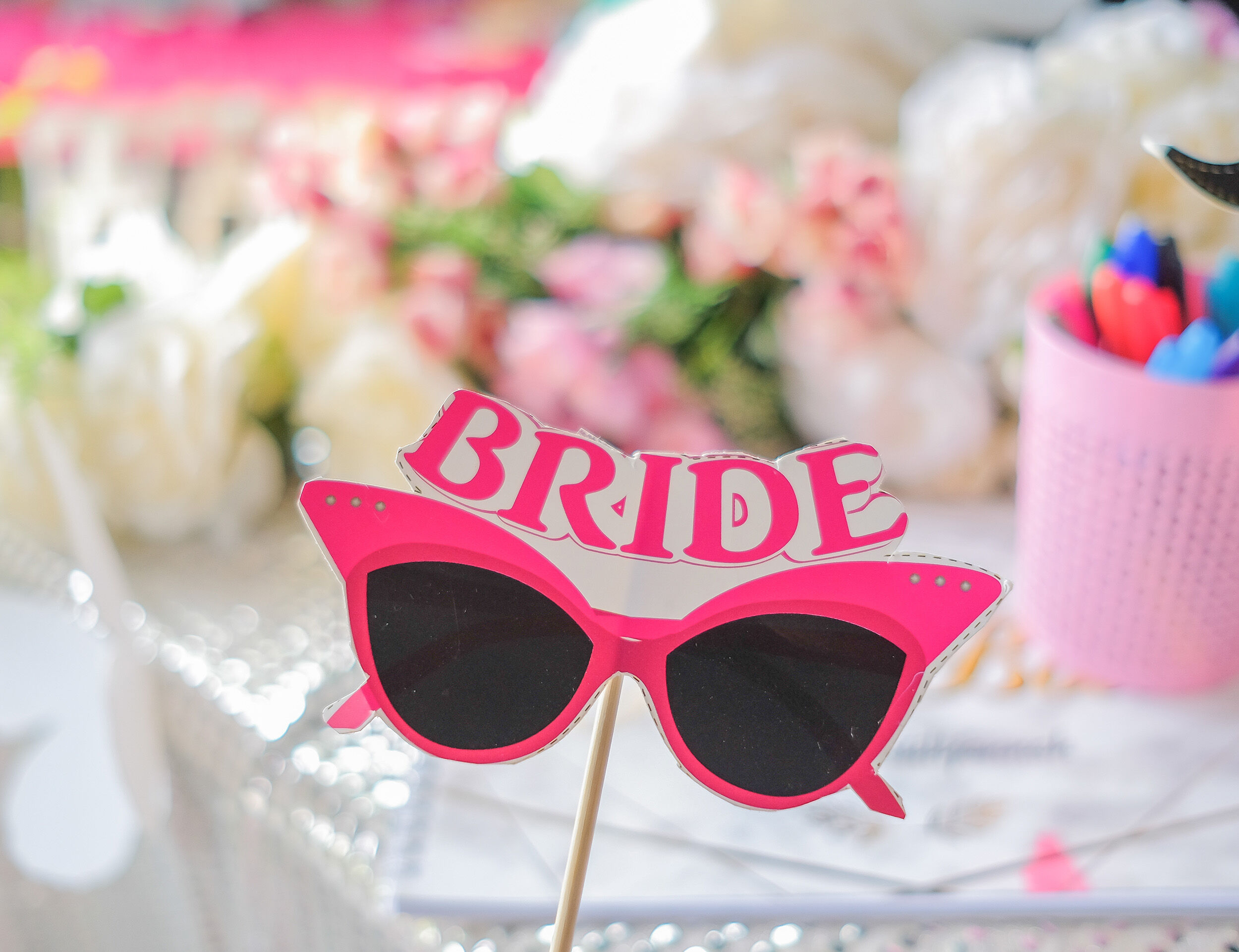 Personalized bridal goggles with the bride's name, a unique wedding gift idea.